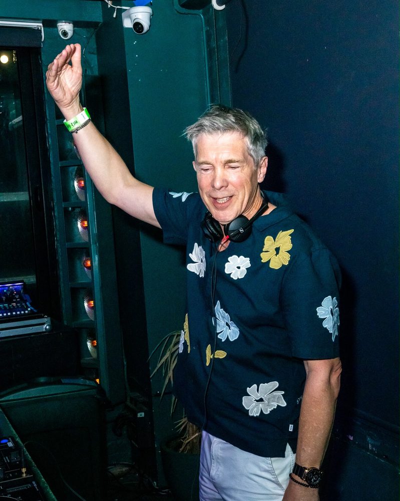 Michael Gray dancing in the DJ booth